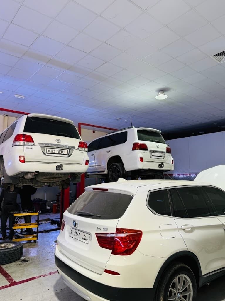 Vehicles raised on lifts for inspection at Al Sulaiman Garage